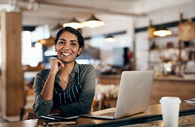 smiling woman with laptop